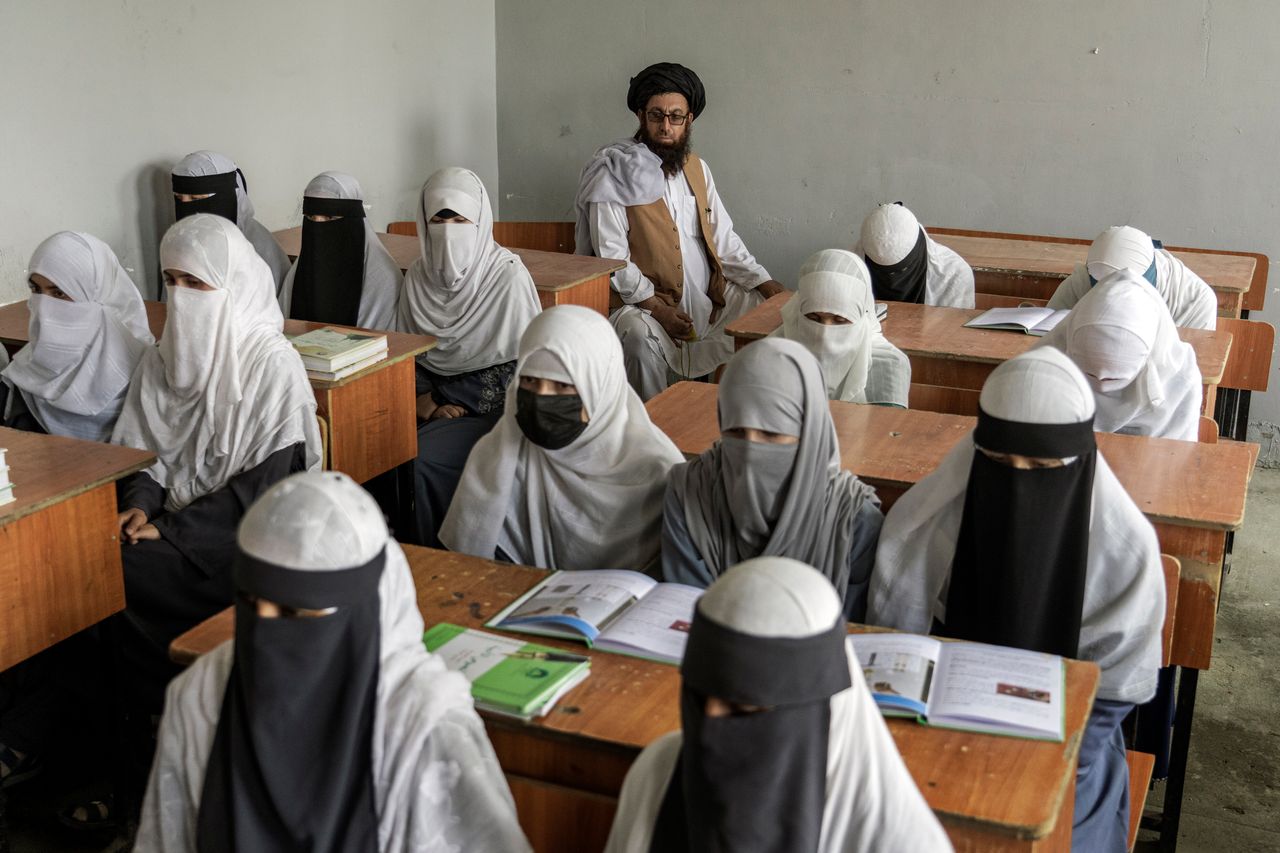 Afghan girls attend a religious school that opened since the Taliban takeover last year in Kabul, Afghanistan, on August 11, 2022. 
