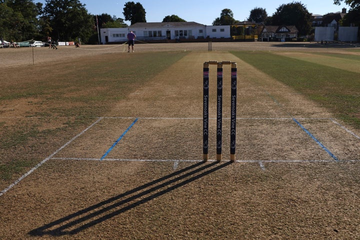 The long shadow of the stumps is seen on the dry ground at Sevenoaks Vine Cricket Club in Kent.