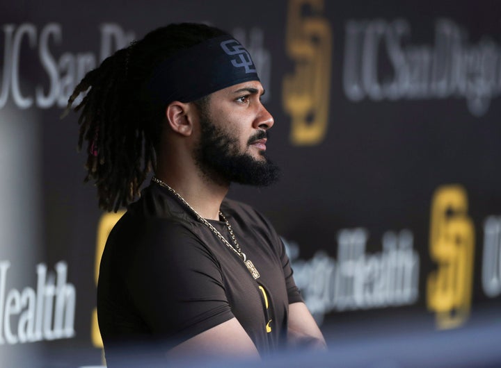 FILE - San Diego Padres' Fernando Tatis Jr. looks out from the dugout prior to the team's baseball game against the Philadelphia Phillies on June 25, 2022, in San Diego. Tatis was suspended 80 games by Major League Baseball on Friday, Aug. 12, after testing positive for a performance-enhancing substance. The penalty was effective immediately, meaning the All-Star shortstop cannot play in the majors this year. Tatis had been on the injured list all season after breaking his left wrist in spring training. (AP Photo/Derrick Tuskan, File)