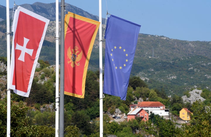 Flags flew at half-mast in front of the site of the attack in Cetinje, some 30 km west of Podgorica, Montenegro, Saturday, Aug. 13, 2022.