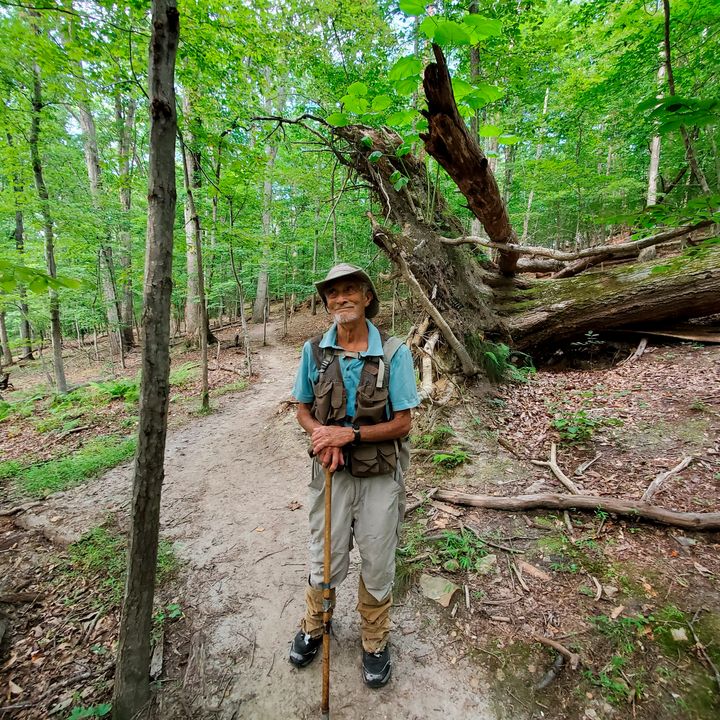 In this photo provided by Joe Villari, with the Virginia Outdoors Foundation, William H. “Marty” Martin poses for a picture at the Bull Run Mountains Preserve in Broad Run, Va., in July 2021.