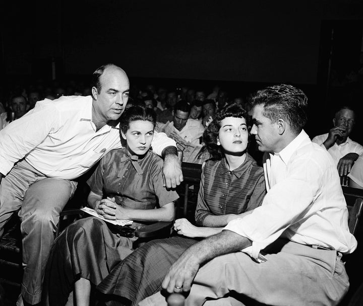 CORRECTS LOCATION TO MISSISSIPPI FROM MISSOURI - FILE - In this Sept. 23, 1955, file photo. J.W. Milam, left, and Roy Bryant, right, sit with their wives in a courtroom in Sumner, Miss. Milam and Bryant were acquitted of murder in the slaying of Emmett Till. Wheeler Parker and Deborah Watts, cousins of Till, said authorities should take a fresh look at the killing of Till since Carolyn Donham, then wife of Roy Bryant, who was at the center of the case, is now quoted as saying she lied in a new book. (AP Photo/File)