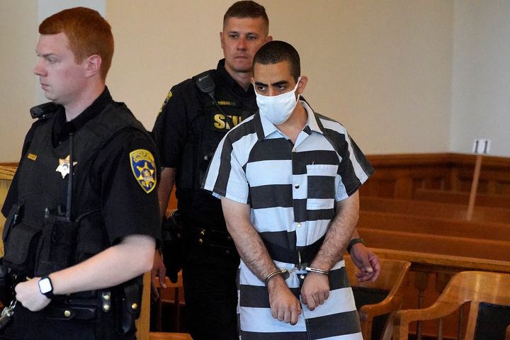 Hadi Matar, 24, arrives for an arraignment in the Chautauqua County Courthouse in Mayville, NY., Saturday, Aug. 13, 2022. Matar, accused of carrying out a stabbing attack against “Satanic Verses” author Salman Rushdie has entered a not guilty plea in a New York court on charges of attempted murder and assault. (AP Photo/Gene J. Puskar)