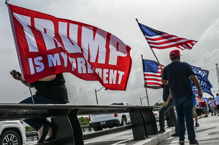 Supporters of former President Donald Trump gather near his residence at Mar-A-Lago in Palm Beach, Florida, after the property was searched by the FBI.