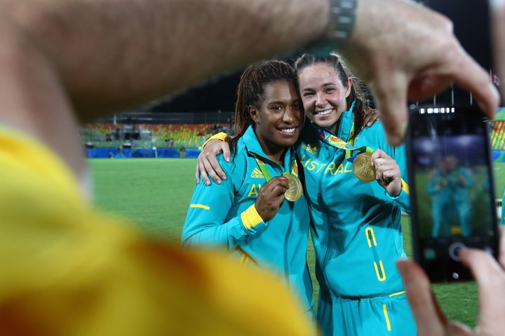Ellia Green, left, of Australia celebrates winning a gold medal with teammate Chloe Dalton in the Women's Rugby Sevens at the Rio Olympics in 2016. 