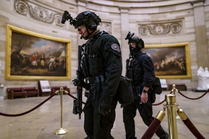 Members of the U.S. Secret Service Counter Assault Team walk through the Rotunda as they and other federal police forces responded as violent protesters loyal to President Donald Trump stormed the U.S. Capitol in Washington, Jan. 6, 2021. Top congressional Democrats are demanding that the Department of Homeland Security's inspector general hand over information on deleted Secret Service text messages related to the Jan. 6, 2021 attack on the Capitol, accusing him of using delay tactics to stonewall their investigation. (AP Photo/J. Scott Applewhite, File)