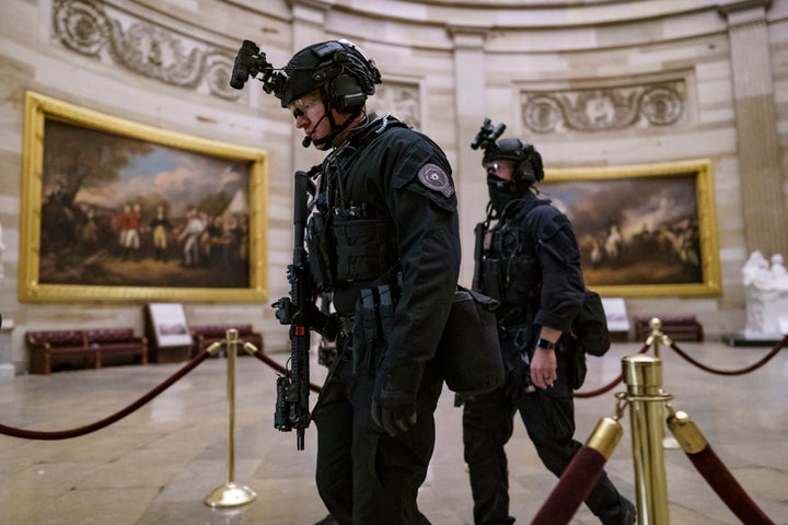 Members of the U.S. Secret Service Counter Assault Team walk through the Rotunda as they and other federal police forces responded as violent protesters loyal to President Donald Trump stormed the U.S. Capitol in Washington, Jan. 6, 2021. Top congressional Democrats are demanding that the Department of Homeland Security's inspector general hand over information on deleted Secret Service text messages related to the Jan. 6, 2012 attack on the Capitol, accusing him of using delay tactics to stonewall their investigation. (AP Photo/J. Scott Applewhite, File)