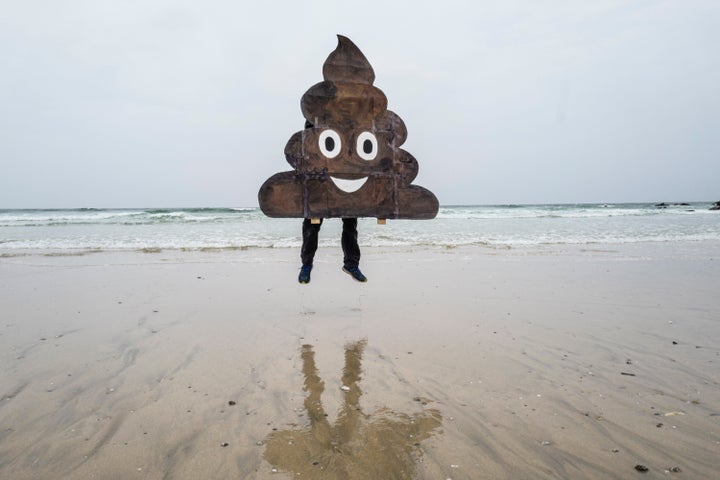 A campaigner with a placard makes a statement during the Surfers Against Sewage demonstration at Fistral Beach.