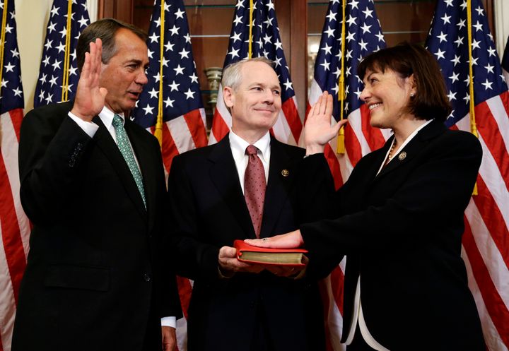 Kurt DelBene (center) pictured with his wife, Rep. Suzan DelBene (D-Wash.), and then-House Speaker John Boehner (R-Ohio), in 2012, the year she first became a member of Congress.