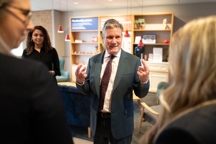 Labour leader Keir Starmer speaks with staff members during a visit to the Nationwide Building Society's headquarters in Swindon, Wiltshire.