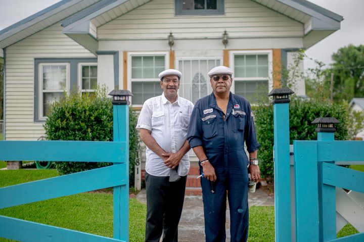 Brothers Byron, left, and Angelo Bernard pose outside a house in Reserve, Louisiana, part of what's known as "Cancer Alley." Industrial pollution on this ribbon of land between New Orleans and Baton Rouge puts the mostly African-American residents at nearly 50 times the risk of developing cancer than the national average, according to the Environmental Protection Agency.