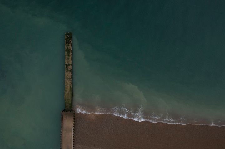 A jetty beneath which raw sewage had been reportedly been discharged after heavy rain on in Seaford, England.