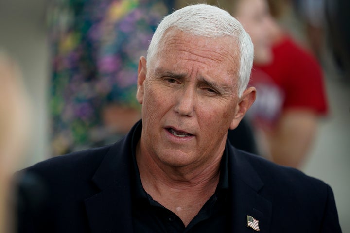 Former Vice President Mike Pence speaks to reporters during a visit to the Iowa State Fair, Friday, Aug. 19, 2022, in Des Moines, Iowa.