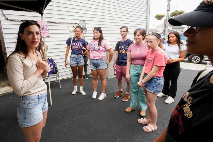 Biaggi (left) talks to volunteers at a canvass launch in Sleepy Hollow, New York, on Aug. 13. With fewer funds, her campaign has relied on a strong ground game.