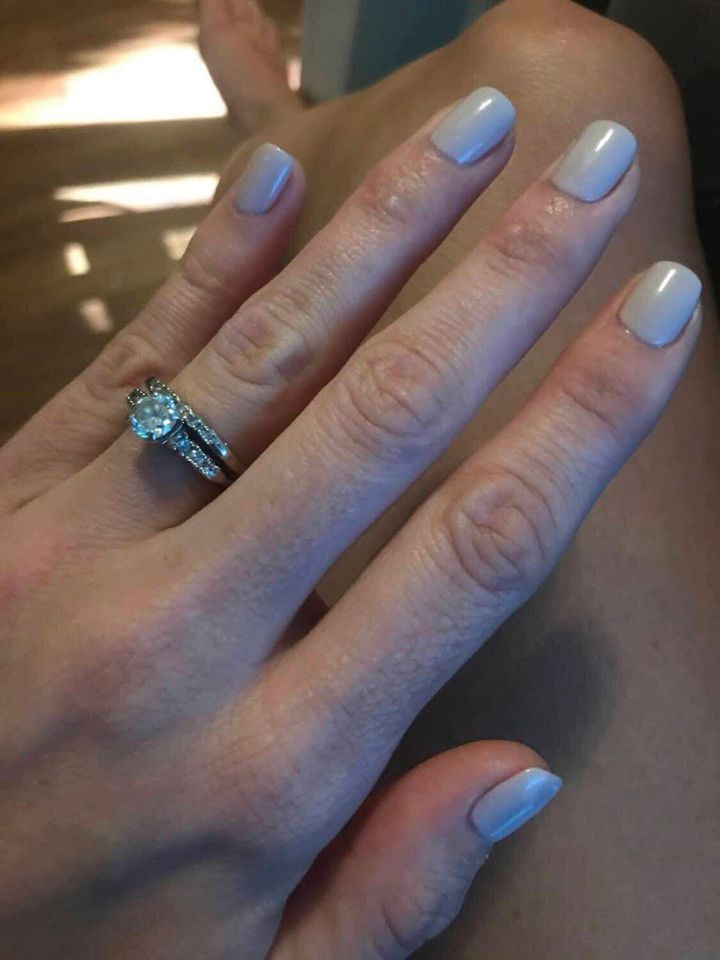 Francesca Teal shows off her wedding ring that was briefly lost at a New Hampshire beach.