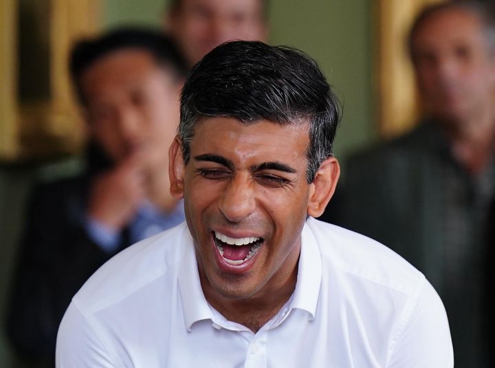 Rishi Sunak laughs during a visit to Cluny Castle in Inverurie during a campaign visit on August 16, 2022 in Inverurie, Scotland. 
