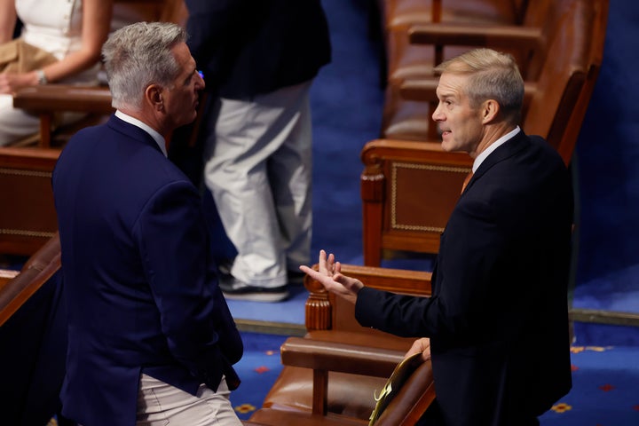 House Minority Leader Kevin McCarthy (R-Calif.) talks with Rep. Jim Jordan (R-Ohio) in the House Chamber on June 24 in Washington, D.C.