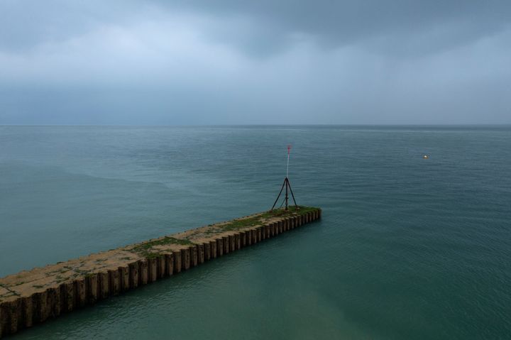 A jetty beneath which raw sewage had been reportedly been discharged after heavy rain on in Seaford, England.