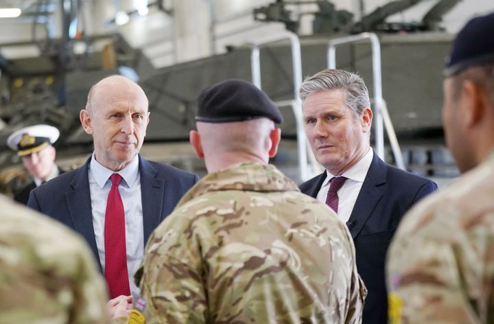 Shadow defence secretary John Healey [left] talk to troops during a visit to Tapa Military Base in Estonia.