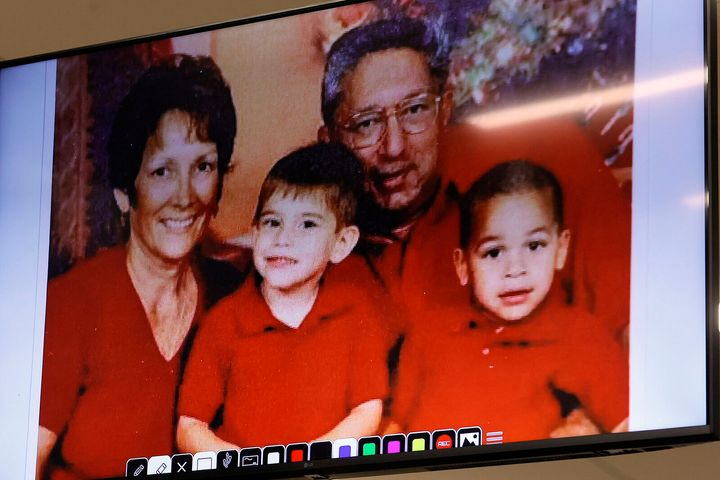 Cruz is seen in a family photo with his adopted parents and half-brother Zachary. This was one of several photos shown to the court on Tuesday.
