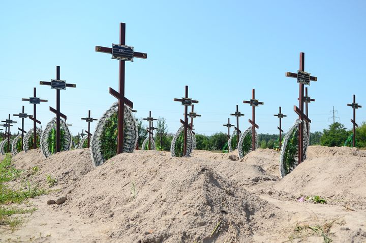Freshly dug graves for unidentified civilians killed by the Russian military in Bucha massacre in February-March 2022