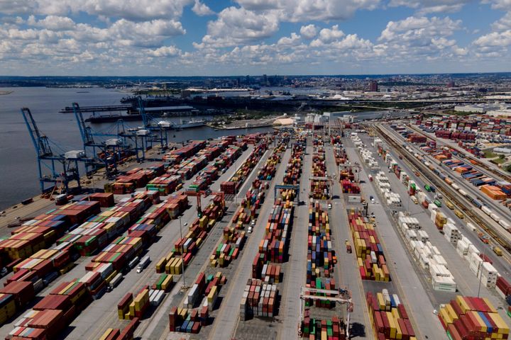Shipping containers are stacked together at the Port of Baltimore, on Aug. 12, 2022, in Baltimore. Six months into the war in Ukraine, American companies — including federal contractors — continue to buy everything from birch wood flooring to weapons-grade titanium from major Russian corporations. 
