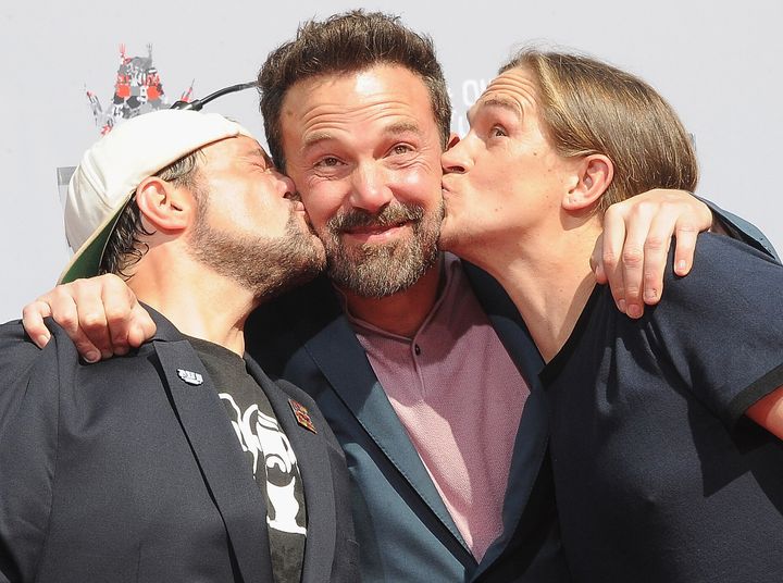 Kevin Smith and Jason Mewes kiss Ben Affleck in 2019.