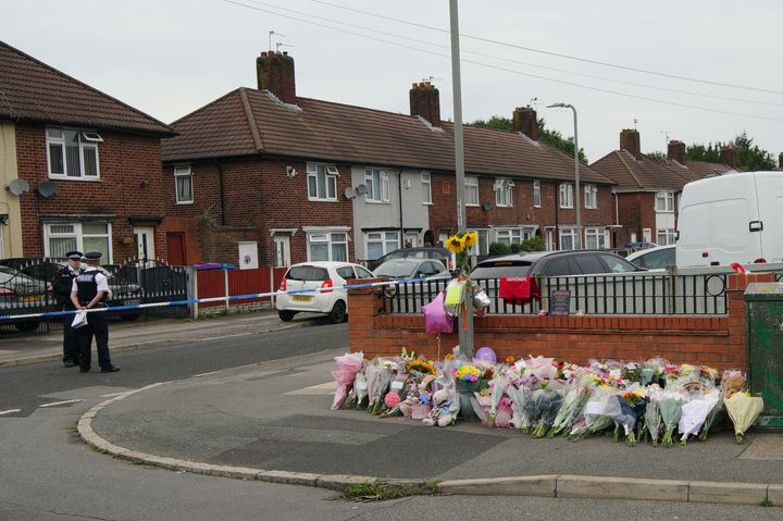 Flowers are left near to the scene of an incident in Kingsheath Avenue, Knotty Ash, Liverpool, where nine-year-old Olivia Pratt-Korbel was fatally shot on Monday night.
