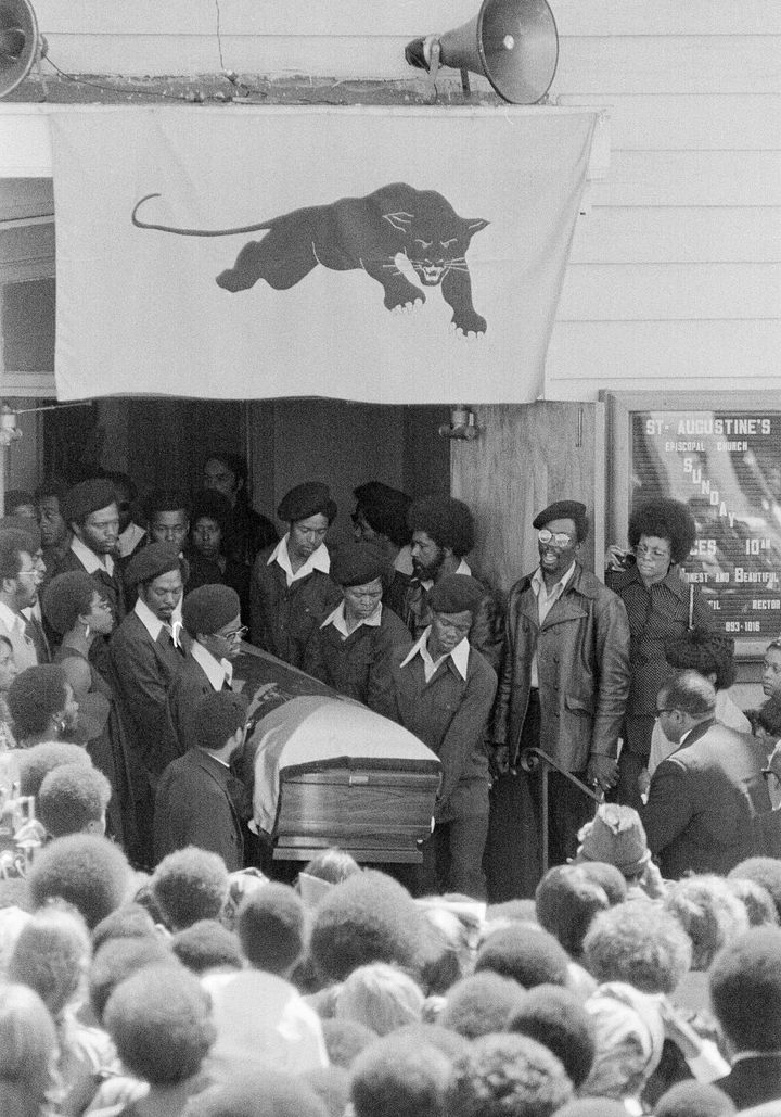 Jackson's casket, draped in a flag with a Black Panther emblem, is carried from St. Augustine's Episcopal Chruch, Aug. 28, 1971, in Oakland, Calif.