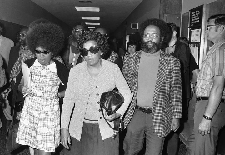 Georgia Jackson, center, accompanied by the Rev. Cecil Williams, right, of Glide Memorial Church in San Francisco, arrive at the Hall of Justice on Aug. 24, 1971, for a court appearance of two surviving Soledad Brothers — John Clutchette and Fleeta Drumgo.