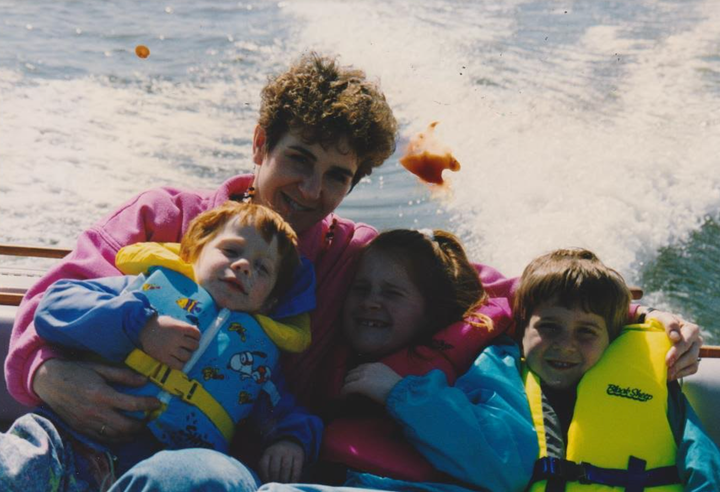 The author and her children in a friend’s boat in 1993. "It was thrilling but also scary to wrangle three children while speeding across the Lake of the Ozarks in mid-Missouri," she writes.