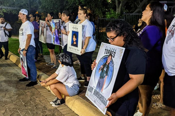 Parents of children who died in the May 24 school shooting in Uvalde stand outside the governor's mansion in Austin, Texas, on Saturday, Aug. 27.