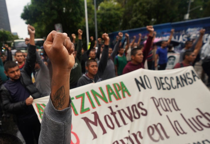 Demonstrators take part in a march seeking justice for the missing 43 Ayotzinapa students in Mexico City, Friday, Aug. 26, 2022. 