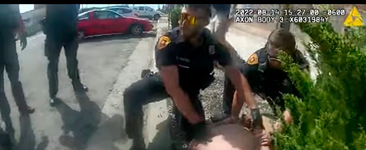 This police body camera still image provided by the Salt Lake City Police Department on Friday, Aug. 26, 2022, shows police officers trying to subdue Nykon Brandon on the street in Salt Lake City on Sunday, Aug. 14, 2022. A caller to 911 in Salt Lake City said the man had come into a brewery in his underwear, tried to steal beer and was running around in the street, posing a danger to himself and to drivers. Police tried to detain the man. Within minutes, Brandon was dead.
