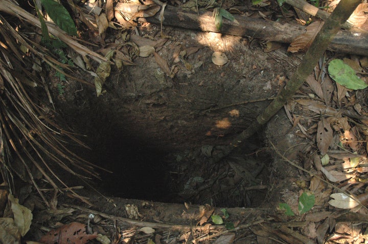 The man was dubbed "Man in the Hole" because of deep holes he would dig to capture prey and to hide in. One of his holes is pictured.