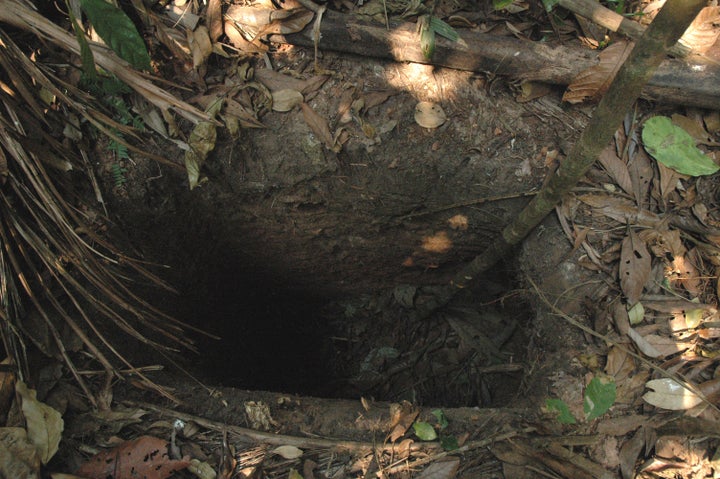 The man was dubbed "Man in the Hole" because of deep holes he would dig to capture prey and to hide in. One of his holes is pictured. 