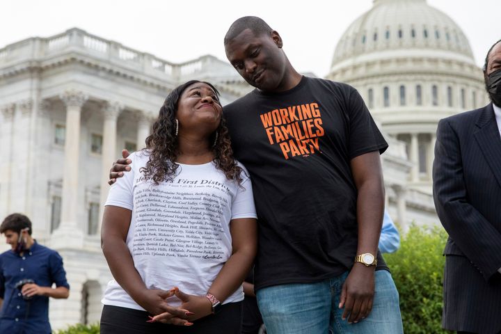 Rep. Mondaire Jones (right) embraces Rep. Cori Bush after President Joe Biden announced an extension of the federal eviction moratorium in August 2021. He was sporting a Working Families Party T-shirt.