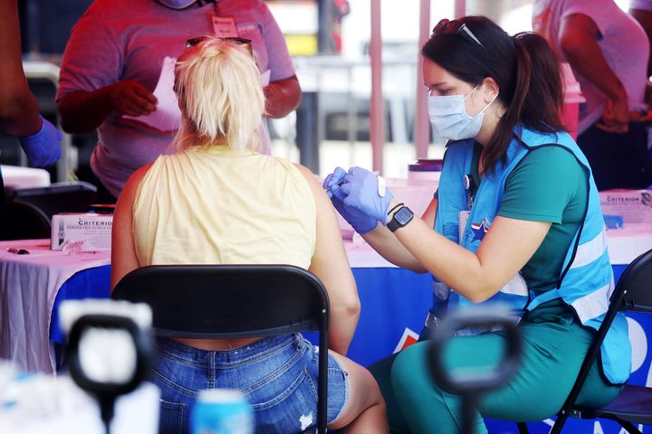 A woman receives a dose of monkeypox vaccine in New Orleans on Aug. 13. There have been more than 18,000 confirmed cases in all 50 states since the first case was detected in the U.S. in mid-May.