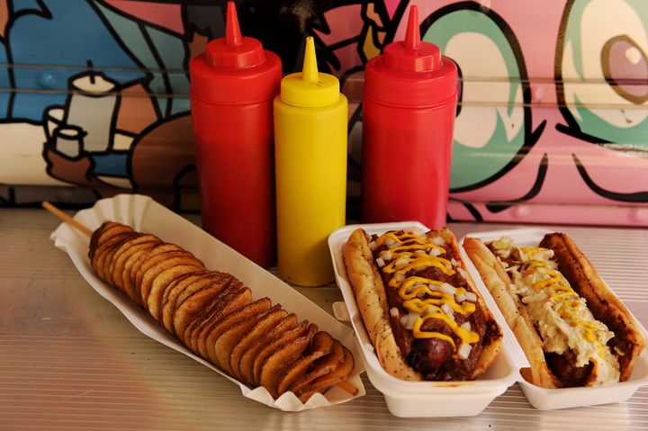 On the far right is a West Virginia style slaw dog, as seen on the "Greatest American Hot Dogs" food truck in Potomac, Maryland.
