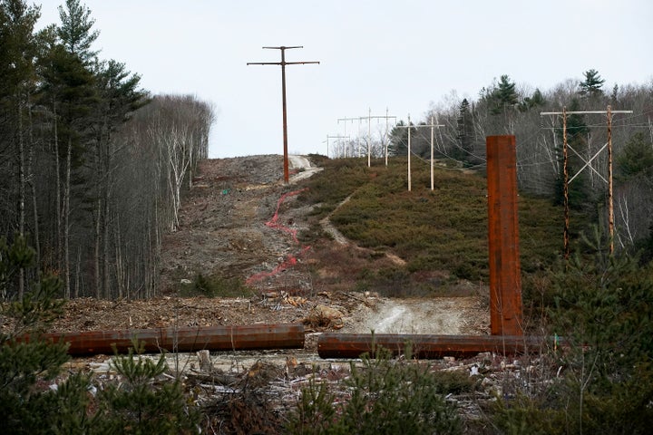 A partially completed tower and a finished tower are seen in a section of the transmission line along Route 201 in Bingham, Maine, last November.