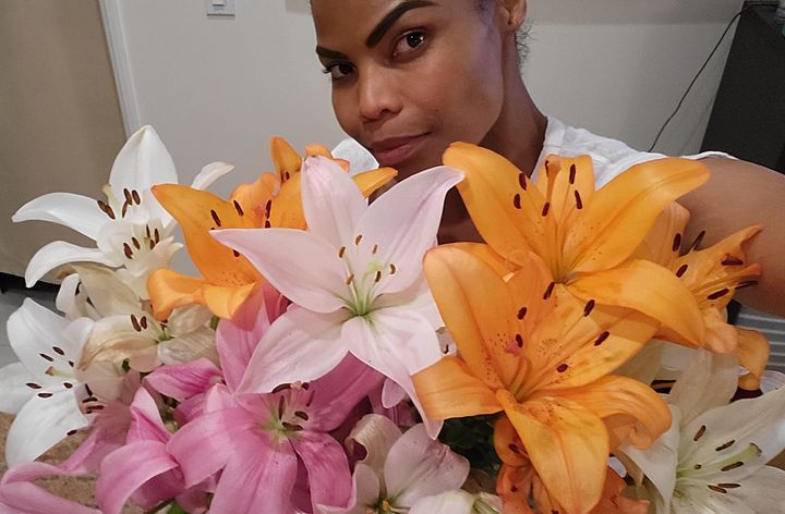 The author with flowers that her boyfriend got her for "no reason other than wanting her to have a good day."