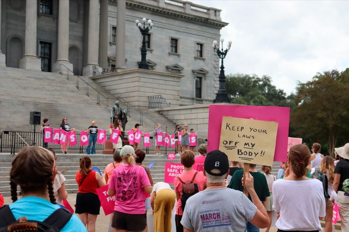 Protesters gather outside the state house in opposition to a proposed abortion ban debated Tuesday, Aug. 30, 2022 by the South Carolina House of Representatives in Columbia, S.C.