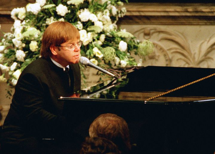 Elton performing a rewritten version of his song Candle In The Wind as a tribute to Diana, Princess of Wales, at her funeral
