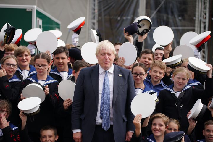 Prime Minister Boris Johnson poses with Sea Cadets from the North West of England during a visit to BAE systems in Barrow-in-Furness, as the UK's newest Astute-Class attack submarine, HMS Anson, is being commissioned into the Royal Navy. Picture date: Wednesday August 31, 2022. (Photo by Peter Byrne/PA Images via Getty Images)