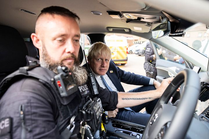 Boris Johnson with a police officer