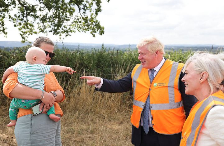Boris Johnson pointing at a baby