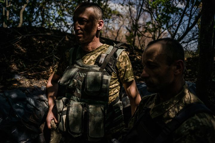 Vitali, 45, left, and Yuri 44, in the trenches on the Kherson frontline in Mykolaiv region, Ukraine, 8th of August 2022.