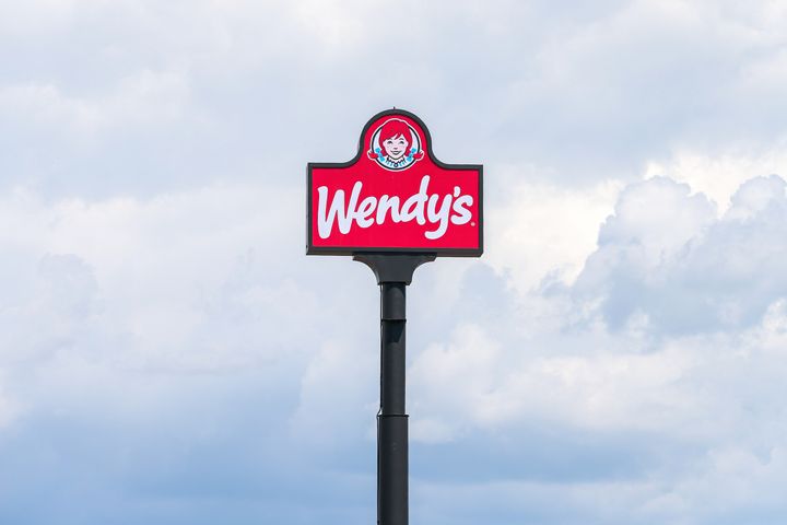 The Wendy's logo sign is seen above a restaurant on Aug. 18, 2022.