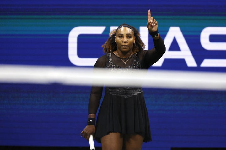 Williams waving her finger to stop the crowd from booing Kontaveit.