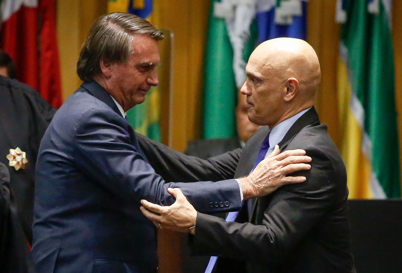 Supreme Court Justice Alexandre de Moraes, right, the caput  of Brazil's apical  electoral court, has fervently defended the country's predetermination  strategy   from Jair Bolsonaro's attacks, insisting that it is clean, transparent and reliable.